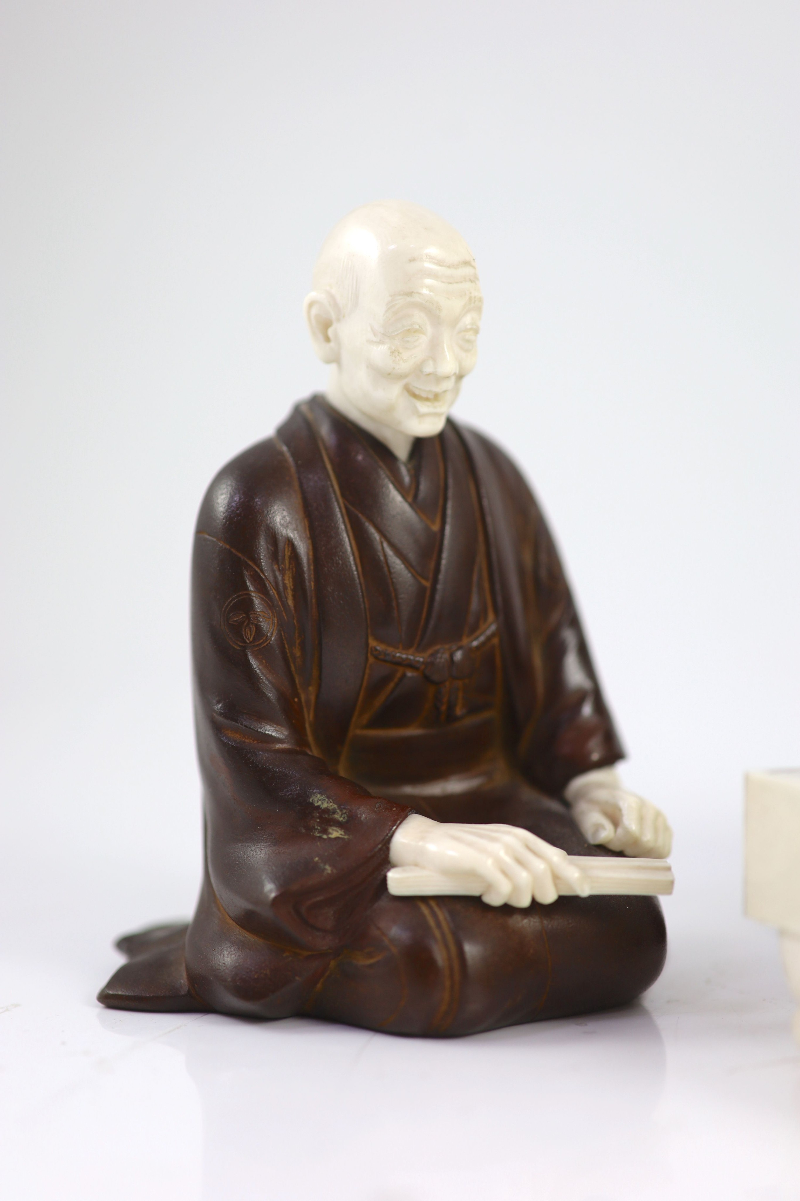 A set of three Japanese bronze and ivory okimono of ‘Go’ players, Meiji period,